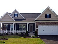 <b>Square Vinyl Columns with decorative touches and white vinyl railing attached to concrete porch flooring 3</b>