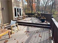 <b>TimberTech Composite deck boards in the Reserve Collection in the color of Dark Roast Trex Composite Railing and Drink Rail in the color of Vintage Lantern</b>