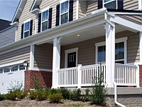 <b>Square Vinyl Columns with decorative touches and white vinyl railing attached to concrete porch flooring 2</b>