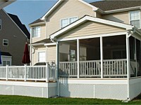 <b>Screened Porch with a gable style roof, finished with siding that matched the original home. The floor boards are composite deck boards and the hand railing is white vinyl. White fascia board wraps around the perimeter of the structure and white vinyl lattice is wrapped around the bottom of the deck.</b>