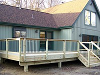 <b>Pressure treated wood deck with wood railing and black aluminum balusters 1</b>