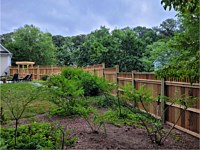 <b>Level and Stepped 5 foot, 6 foot, 7 foot, then 6 foot Cedar Vertical Board Fence w 6x6 Pressure-Treated Posts, Cedar Closed Spindles, Bottom 1x6 Cedar Fascia Boards, and Cedar New England Post Caps.</b>